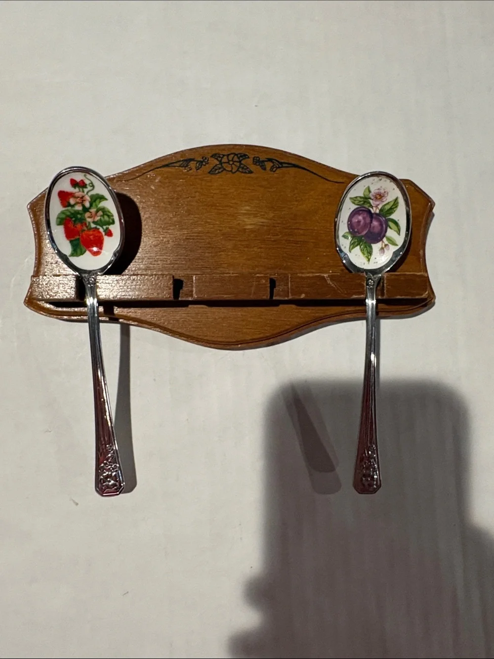 Avon collectors fruit spoons and hang rack